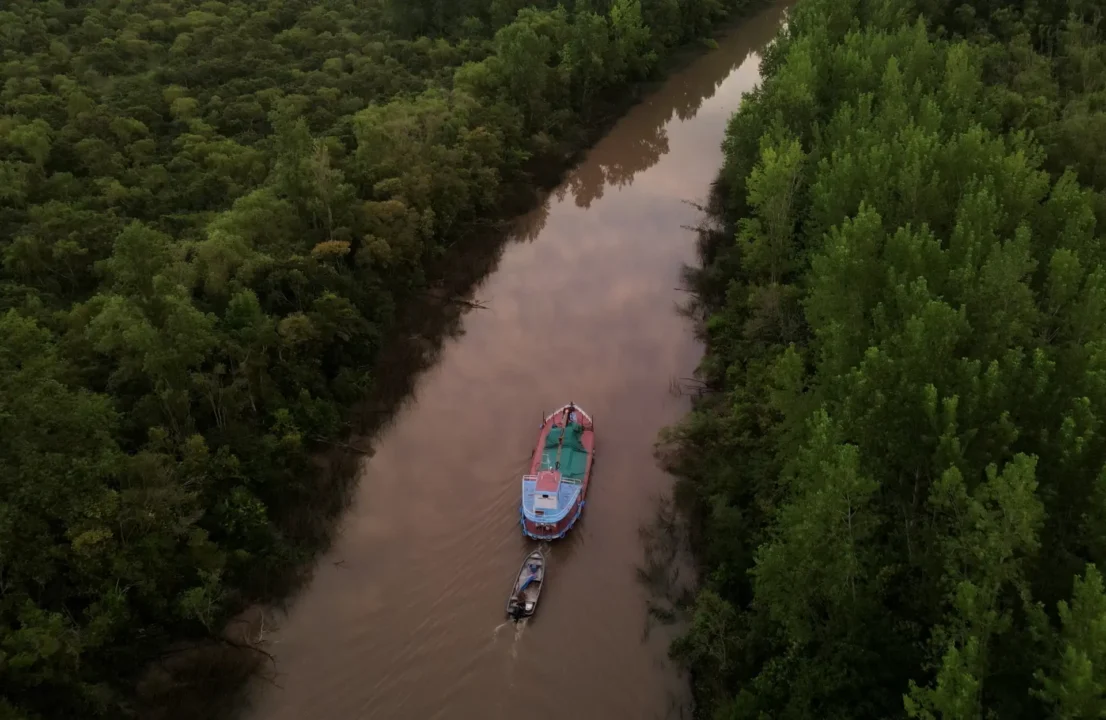 A group of tourists explore the Amazon through one of it's many affluents.
