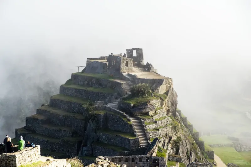 Why did the Incas build using stone instead of wood?