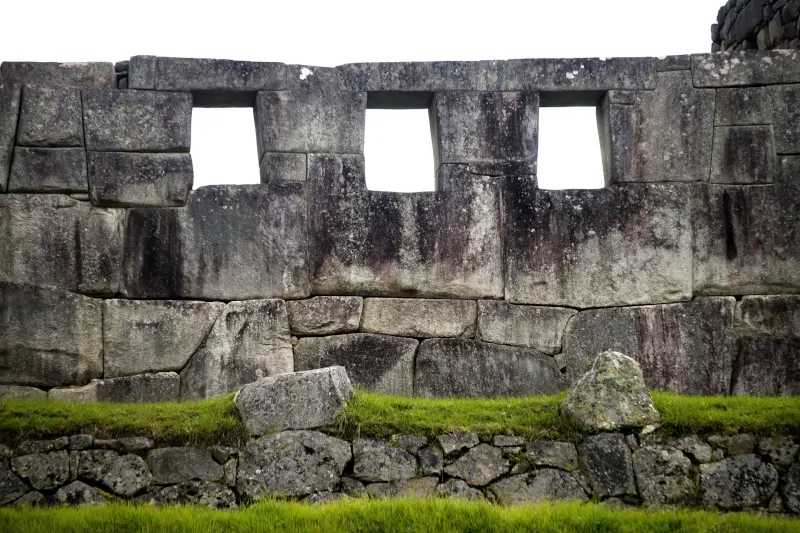 Why did the Incas build using stone instead of wood?