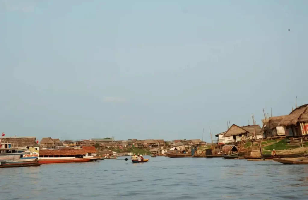 A family rows in a small boat to get back home