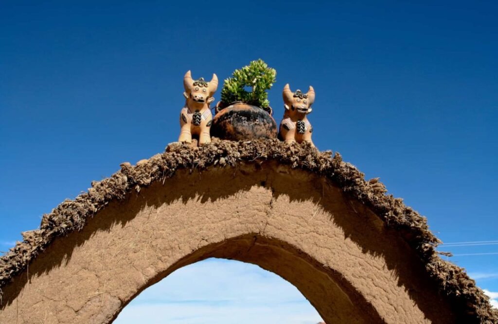 A couple of pucara bulls crown an arc of dried mud, locally known as "adobe"