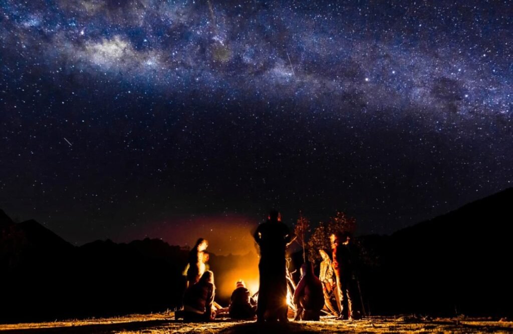 A camping night under a starry sky.